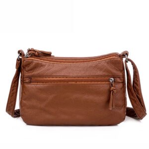 Close‑up of soft leather‑like PU material on the messenger bag
