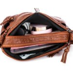 Interior cell phone pocket with zip compartment