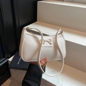 Close-up of waterproof PU leather exterior and bow detail