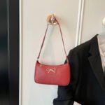 Baguette-shaped shoulder bag showing polyester lining