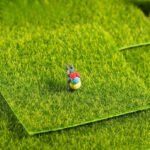 Miniature garden ornament created with the artificial grass terrarium