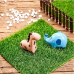DIY bonsai miniature displayed inside the mini artificial grass terrarium